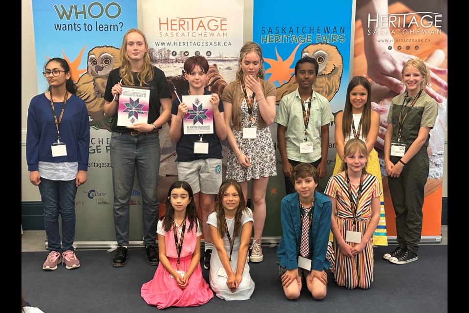 The top winners at this year's Provincial Heritage Fair gather for a group picture. Far left standing is Anabia Yousuf, second from right standing is Kenzie Crocker and seated at right is Abby Hogeboom. Photo courtesy Gillian Crocker