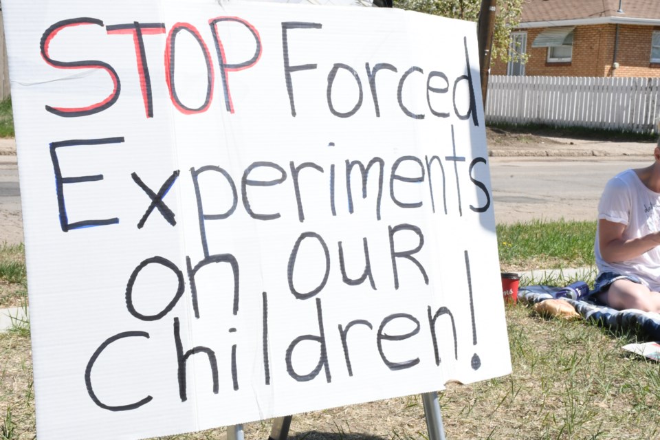 A second protest was held in front of the Prairie South School Division board office on May 18, with two more concerned residents joining Tannis and Ivan Brideau during the demonstration. Photo by Jason G. Antonio 