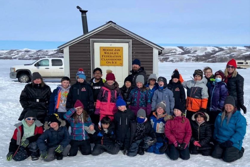 Grade 5 students from Sacred Heart Community School gathered at Buffalo Pound on March 2 to learn more about fish habitats. Photo courtesy Facebook