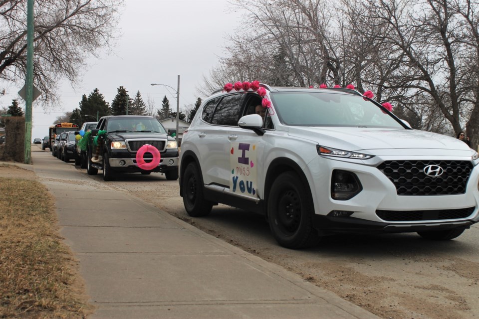 The entire staff joined the lineup, including one of the neighbourhood’s bus drivers in a big yellow school bus, and many decorated their rides to really make a splash.