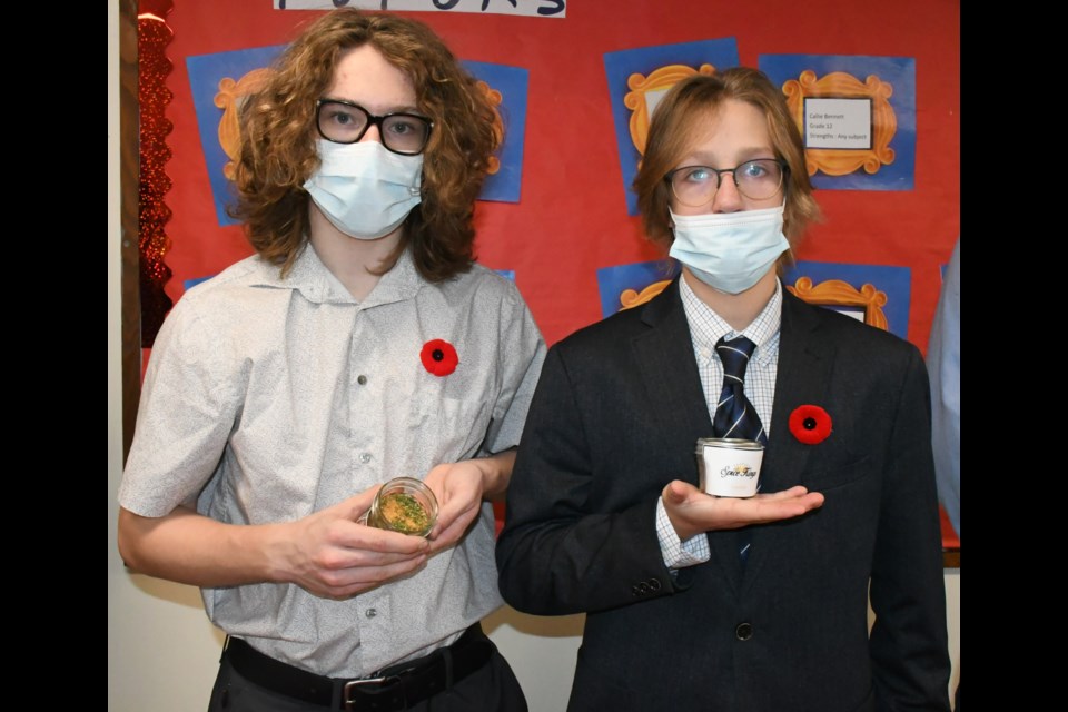 Kendall Ebbett and Ashton Glova display some of the spices that their business, The Spice Kings, is selling. Photo by Jason G. Antonio 