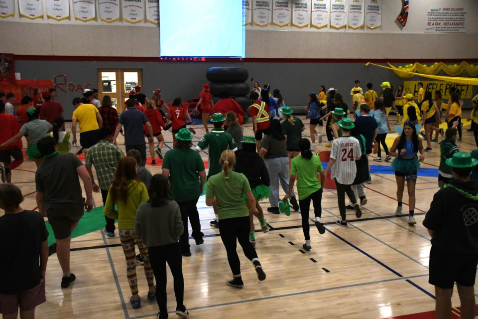 Let's do the boot-scootin' boogie! Students take part in a line dance during a welcome-week activity. Photo by Jason G. Antonio