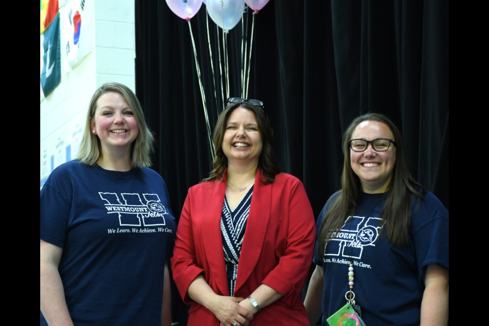 Event co-creators Erika Topp (left) and Amanda Harper (right) stand with keynote speaker Krystal Hawkins (centre) on May 7.