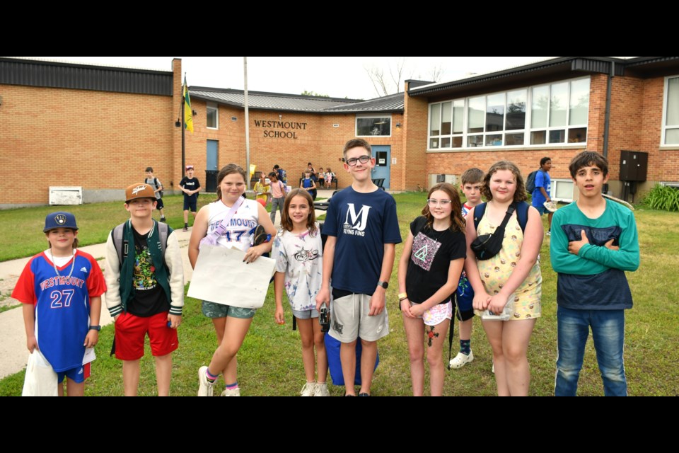 Students gathered for a final group photo in front of Westmount Elementary School on June 26, marking the school’s last day before closing its doors permanently. Blake Gatzke is fifth from the left.
