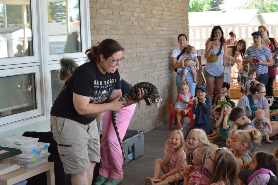 Wrangler Elisa shows off the Black and White Tegu to the crowd