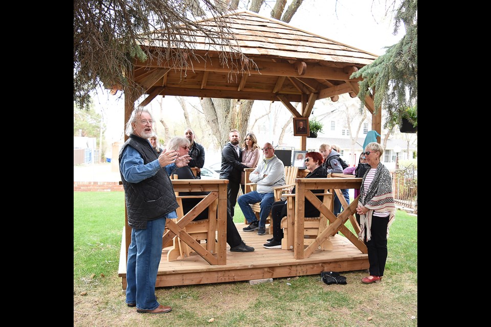 Lloyd Hackel offers the story behind the new Chez Nous gazebo to family members and well-wishers.