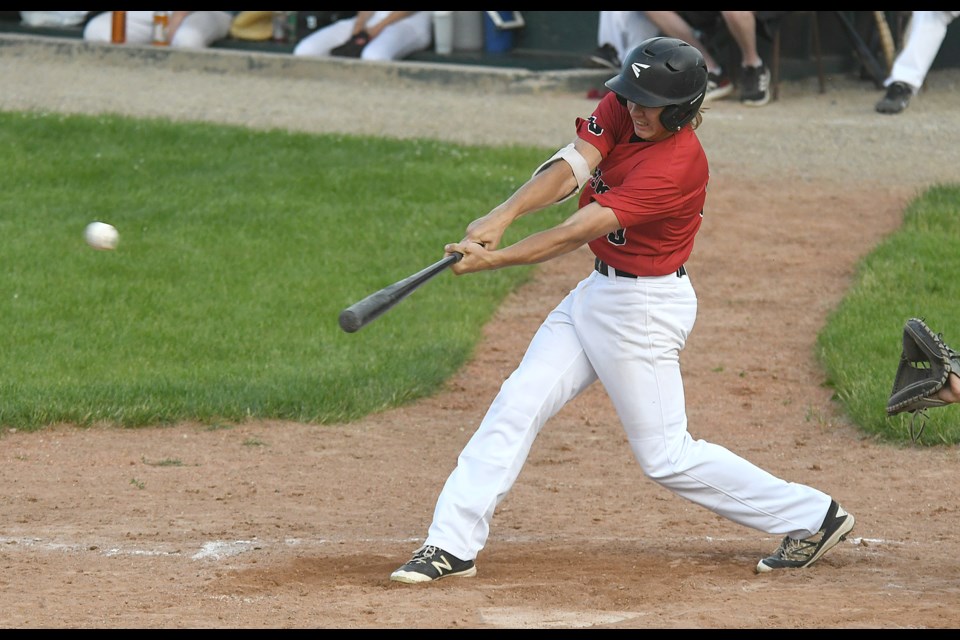 Orin Olson hits a two-run single up the middle during third-inning action. 