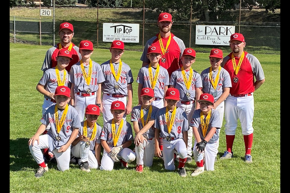 The Moose Jaw 11-and-under AA Canucks with their Baseball Regina silver medals.