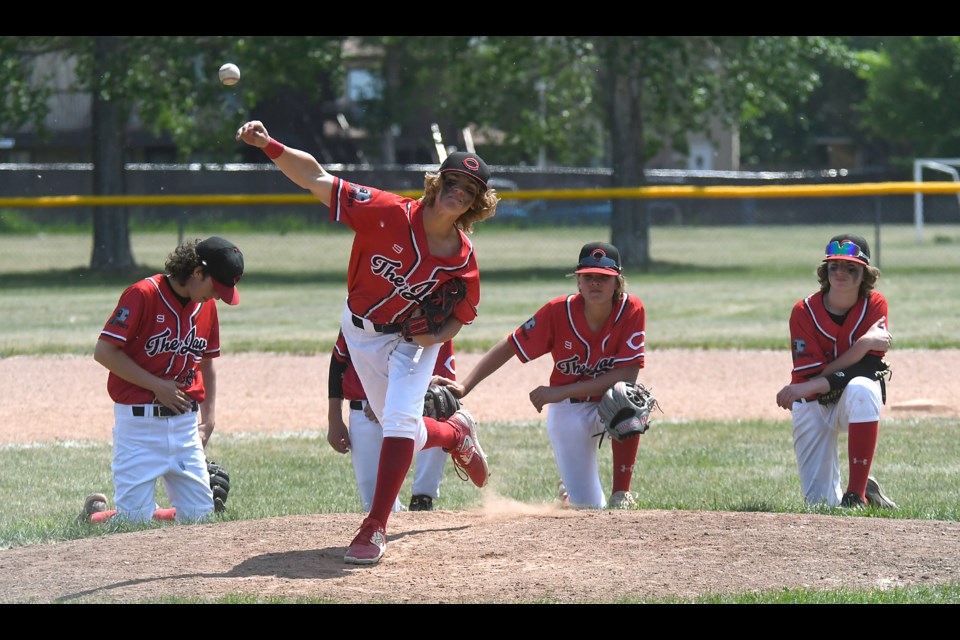 Ronan Tonge warms up in front of his infield prior to finishing off the win in game one of the doubleheader.