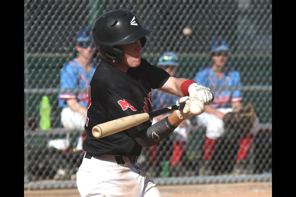 Owen Varjassy puts the game-winning hit into play in the bottom of the eighth inning.