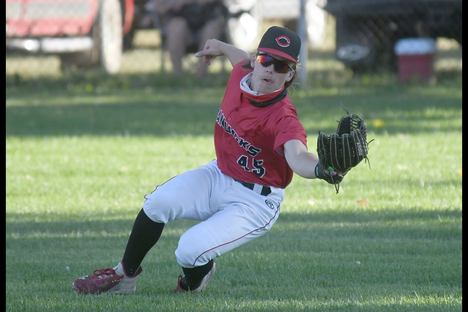 Shaune Reimer makes a diving catch in right field for the Canucks.