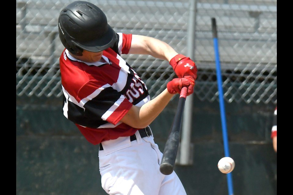 Canucks hitter Grier Peterson squares up an East Central offering.