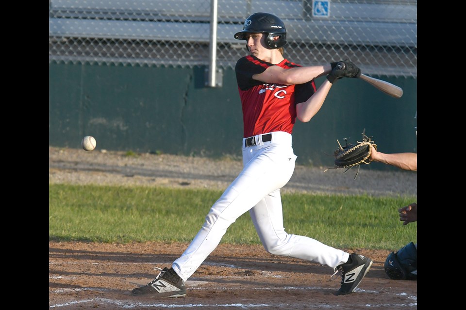 Canucks hitter Ty Reid puts a Regina offering into play.