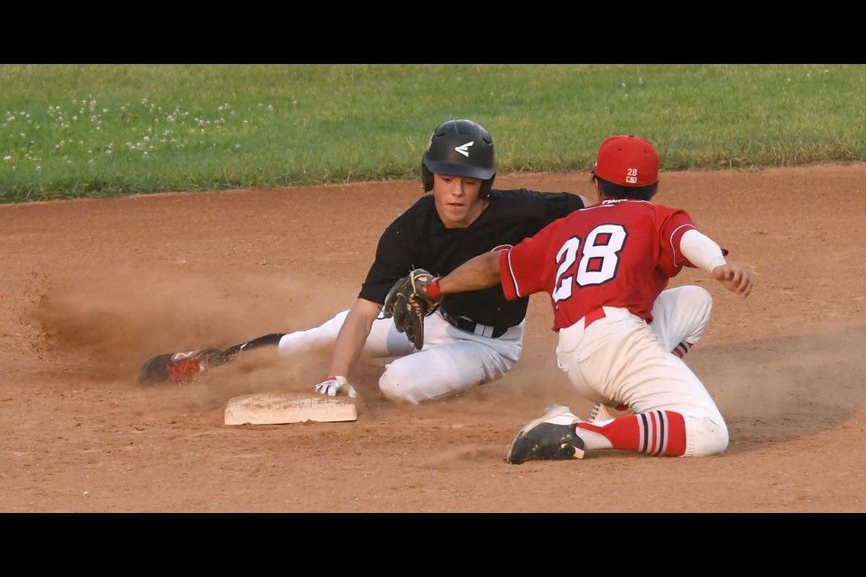 Kaedyn Banilevic successfully slides around the tag to steal second.