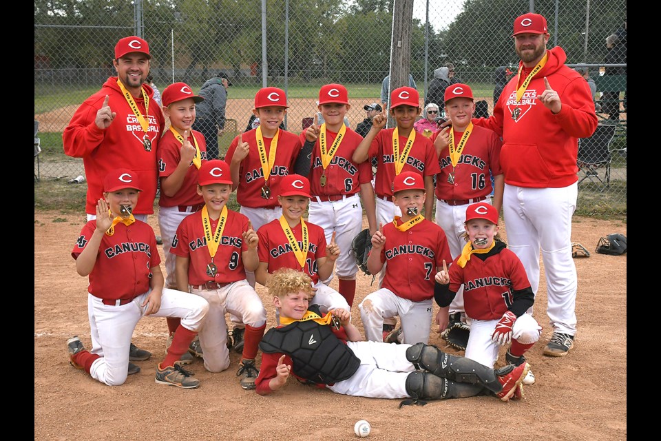 The Moose Jaw Canucks gather for a team photo after their win in the Baseball Regina 11-and-under AA league final.