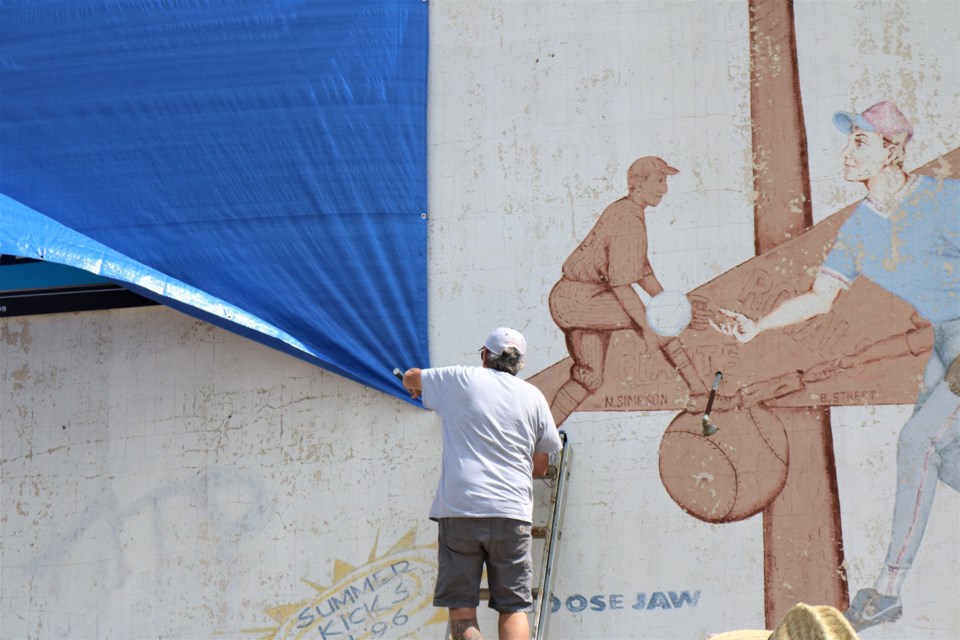 Unveiling the sign. Photo by Scott Hellings