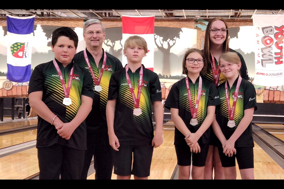 Hunter Anderson and Brekkin Hill along with coach Ken Munro joined Saskatchewan teammates Carrington Straza and Addison Manwaring to win silver in the YBC Nationals Bantam Mixed Teams competition.