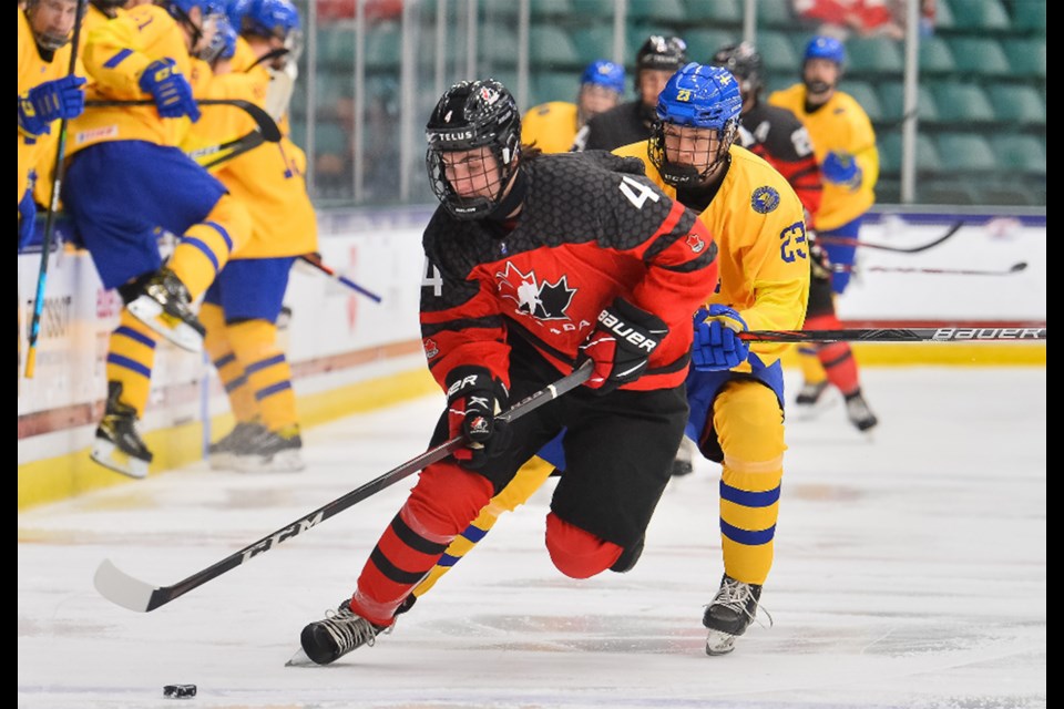 Team Canada's Corson Ceulemans carries the puck up ice against Sweden.