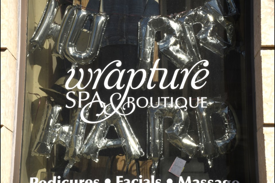 One of the curling-themed window displays featured at Wrapture Spa & Boutique. 