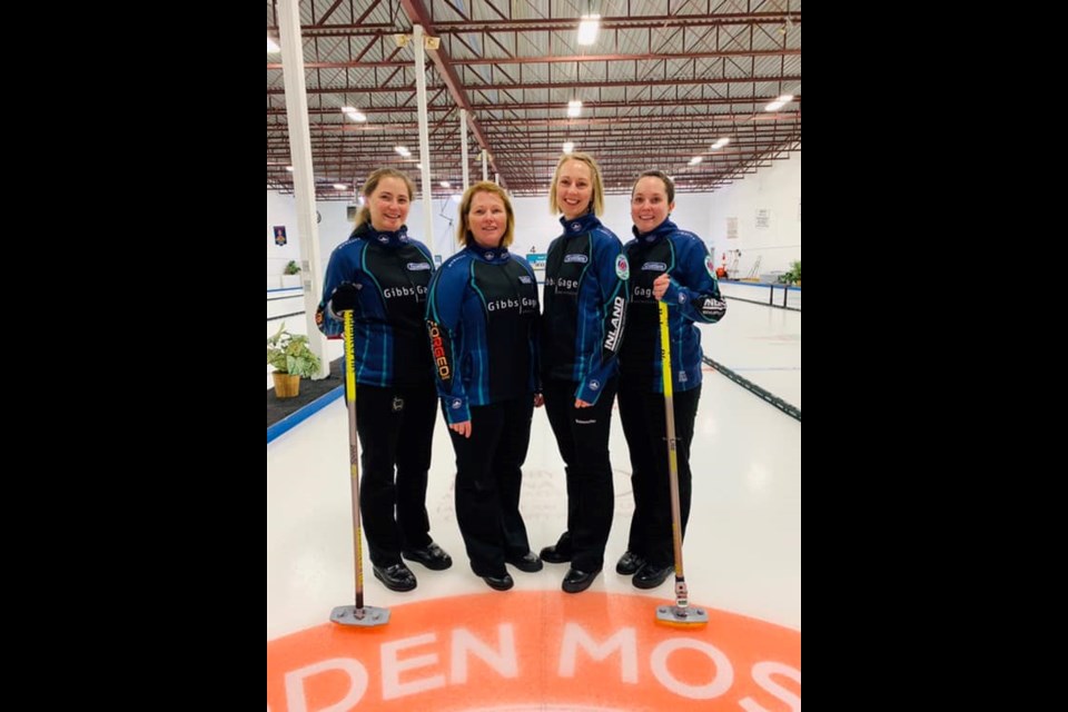 Penny Baker, Deanna Doig, Christie Gamble and Danielle Sicinski pause for a team photo after winning the SWCT Regina Highland.