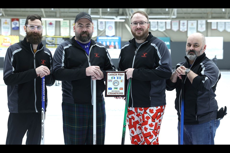 Members of 17 Wing Winnipeg with the championship plaque from the 2022 Canadian Forces Canada West Curling Championship: third Capt. Paul Neilands, lead Capt. Ian Aastrom, skip Capt. Matthew Lazaruk, second Sgt. Frank Charest. 