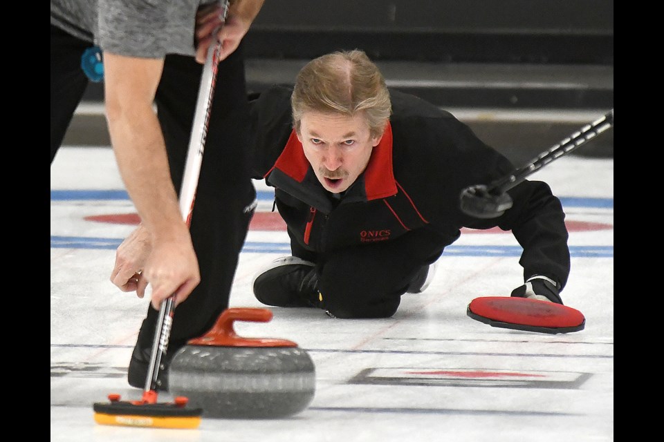 John’s Music skip Ryan Wenarchuk calls out the line during their game against Matt Froehlich.