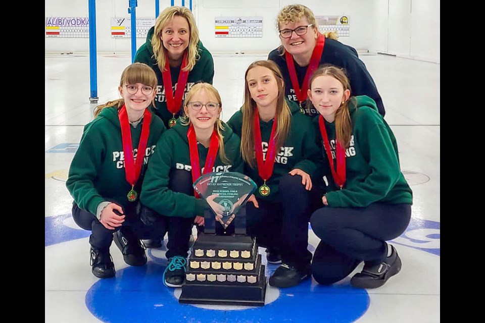 The Peacock curling team of Kaylee Hogeboom, third Abby Hogeboom, second Callista McQueen, lead Kelsey McQueen, coach Barb Owens and supervising teacher Jana Polupski won gold at the SHSAA girls curling championship over the weekend.