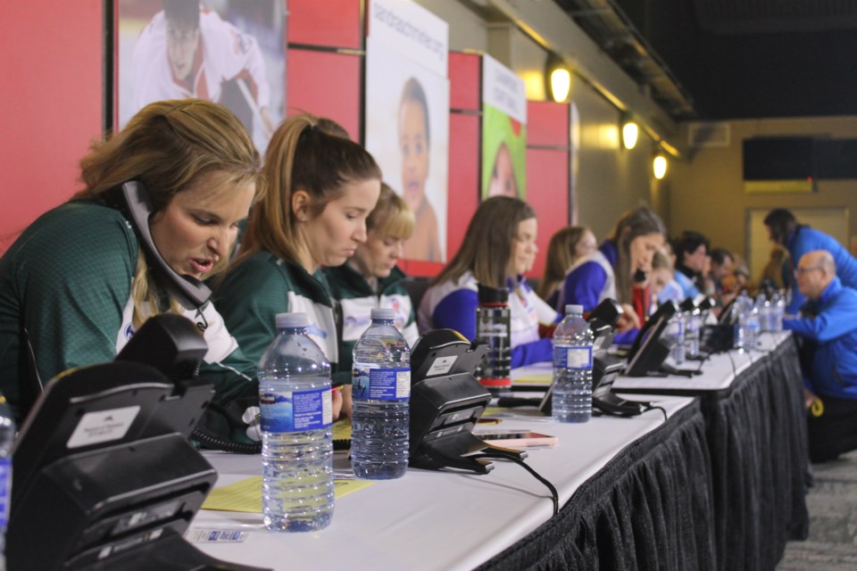 Team Wild Card skip Jennifer Jones was on the phone almost immediately after sitting down, joking with a caller who was from Manitoba as well.