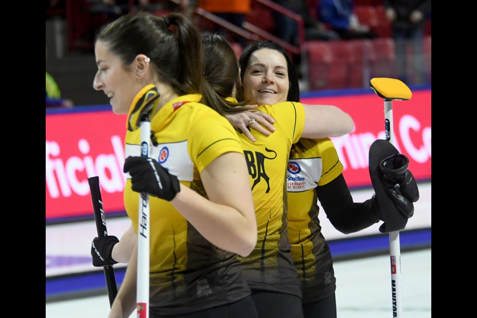 Kerri Einarson and Team Manitoba celebrate their win.