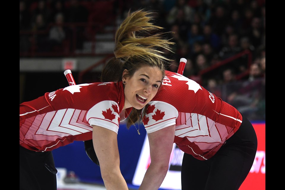 Team Canada's Rachel Brown calls out weight as her and Dana Ferguson sweep.