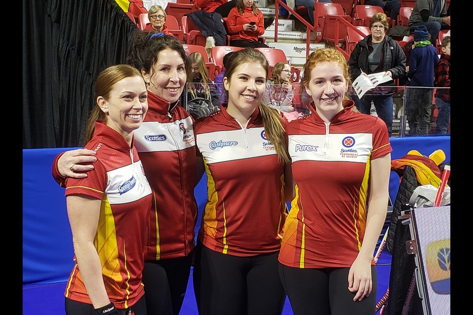 Team Nunavut gather for a photo after their win over Northern Ontario.