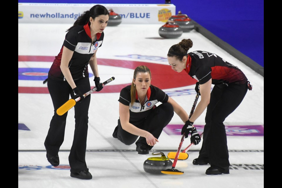 Ontario's Lisa Weagle and Joanne Courtney sweep an Emma Miskew shot.