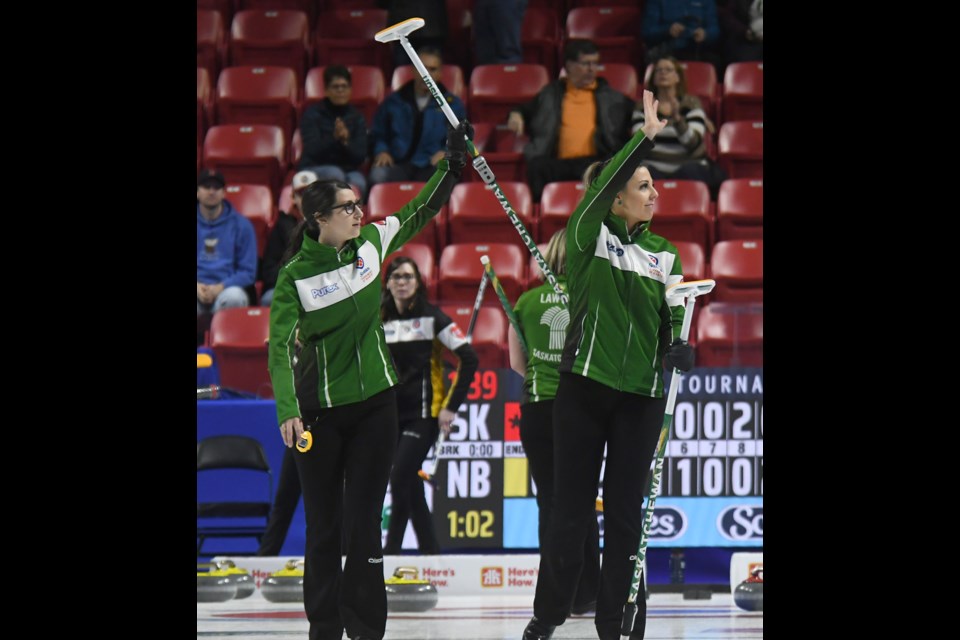 Robyn Silvernagle and Kara Thevenot acknowledge the crowd after their tiebreaker win.