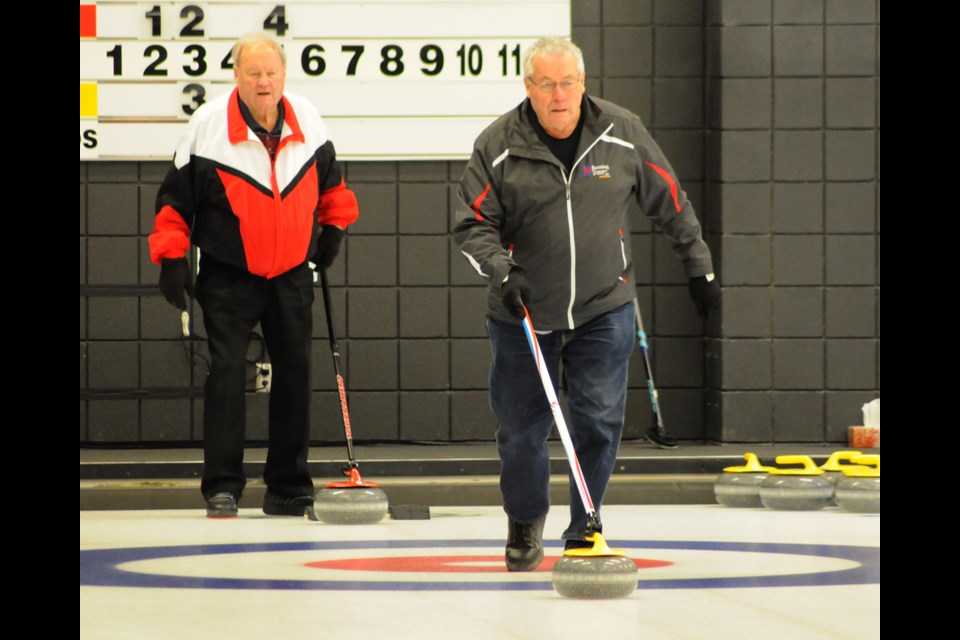 Al Empey delivers a shot during a recent stick curling league contest