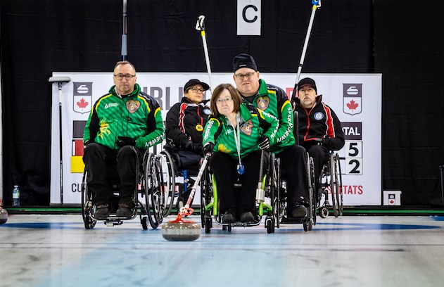 Darwin Bender (left) and Moose Gibson look on as Marie Wright throws a stone for Team Saskatchewan 1 during the final round robin draw of the Curling Canada national wheelchair curling championship. Patrick Beauchemin @ Défi sportif AlterGo 2019 photo.