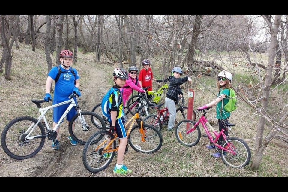 Participants in a previous Learn2MTB course pause for a photo before taking to the trails. Moose Jaw Pavers Facebook photo