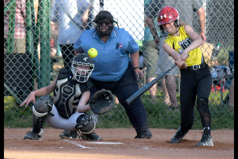 Ashley Breitkreuz looks to go off-field for a base hit.