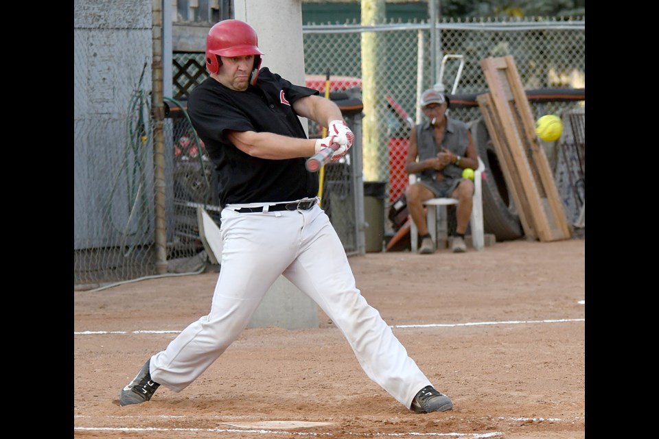 Dustin Thiel hammers a single in first-inning action.