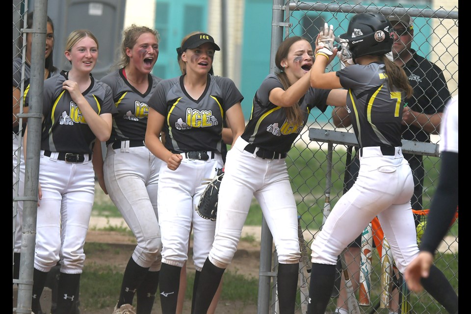 The Moose Jaw Ice celebrate after Gracelyn Blanchard scored their first run against Twin Cities