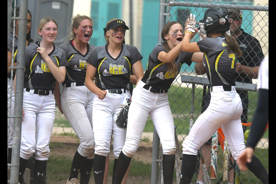 The Moose Jaw Ice celebrate after Gracelyn Blanchard scored their first run against Twin Cities