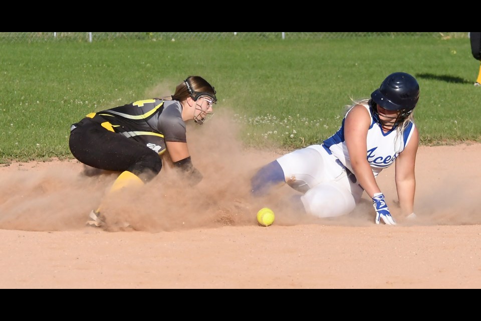 Assiniboia’s Maura Belles slides safely into second as Madison Thul looks to make the tag.