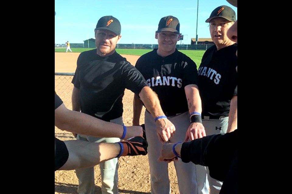 Joe MacDonald (left) and his Moose Jaw Giants teammates were sporting Jax Mac Foundation bracelets for their game Thursday night in Regina. | Dale Garthus