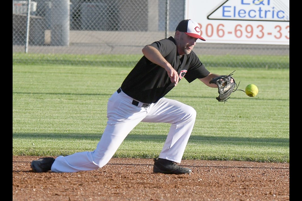 Canadians second baseman Kent Barber knocks down a hard hit ground ball.