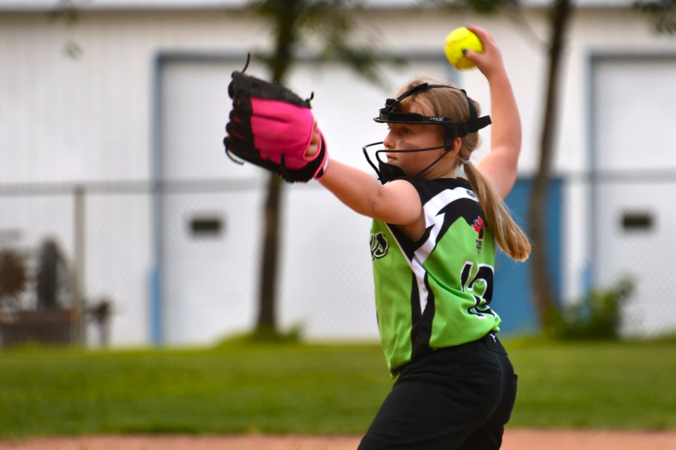 Allison St. Dennis winds up during the U11 Vipers’ gold medal game at Optimist Park on June 30. St. Dennis and fellow pitcher Sophia Ferland combined for a standout performance on the mound in the 4–3 win over Davidson.