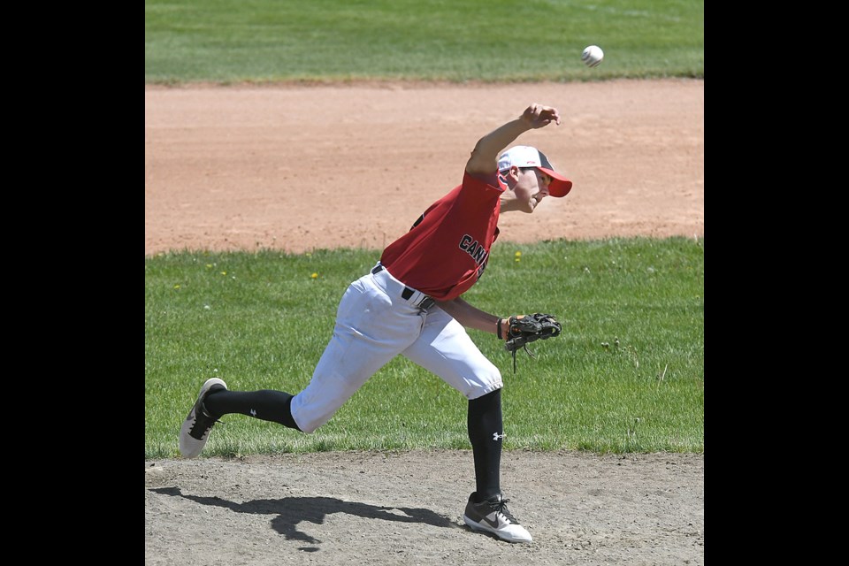 Canucks pitcher Kaedyn Banilevic delivers a pitch during third inning action.