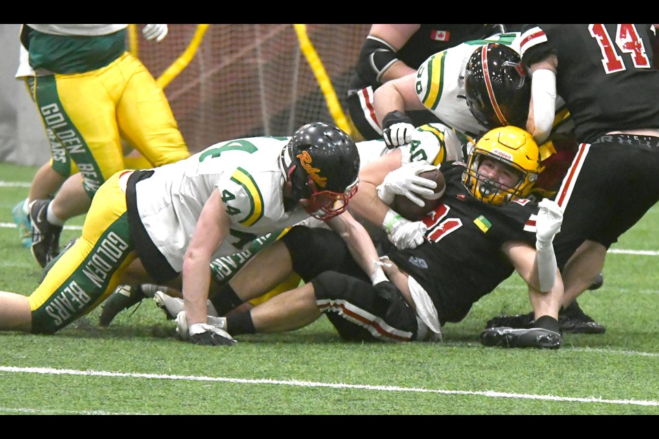 Sask Selects Varsity Black running back Benjamin Singh is tackled after a short gain early in the second half.
