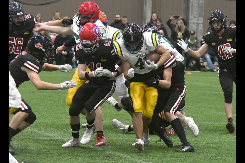 Alberta Varsity Golden Bears running back Riley Gauthier fought for every yard he could on this second-half play.