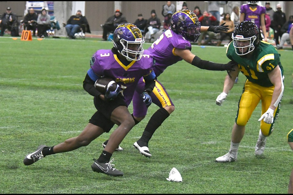 Mamba’s running back Terrel Strong looks for running room against the Golden Bears during the Varsity Black final.