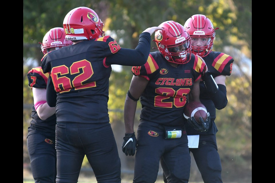Javin Boynton celebrates with teammates after his fourth-quarter touchdown run.