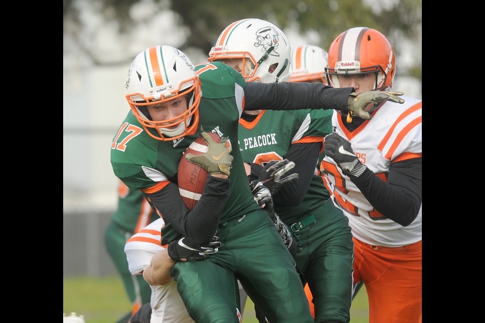 Peacock running back Drake Luebke attempts to break a Yorkton tackle during first-half action.